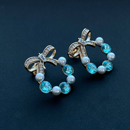 Nagliņu auskari ar bantīti un ziliem kristāliem - 18k - apzeltita - rotas