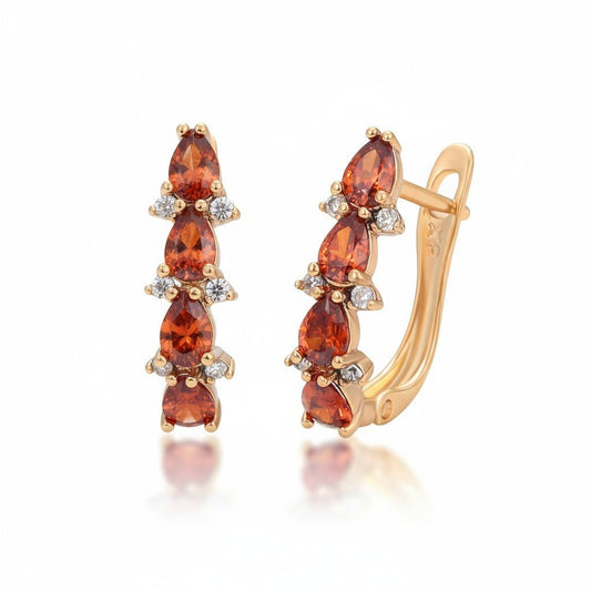 Ruby Glow – Apzeltīti auskari ar sarkaniem akcentiem – apzeltītas rotaslietas | Tavas Rotas